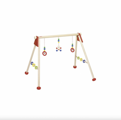 Montessori baby gym with red rings and colorful wooden beads for sensory development